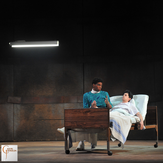 A performance of "Angels In America" at Carnegie Mellon. Prior Walter gets a visit from Belize in his hospital bed.