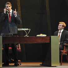 A performance of "Angels In America" at Carnegie Mellon. Roy Cohn Talks on the phone while Joe Pitt waits at his desk.