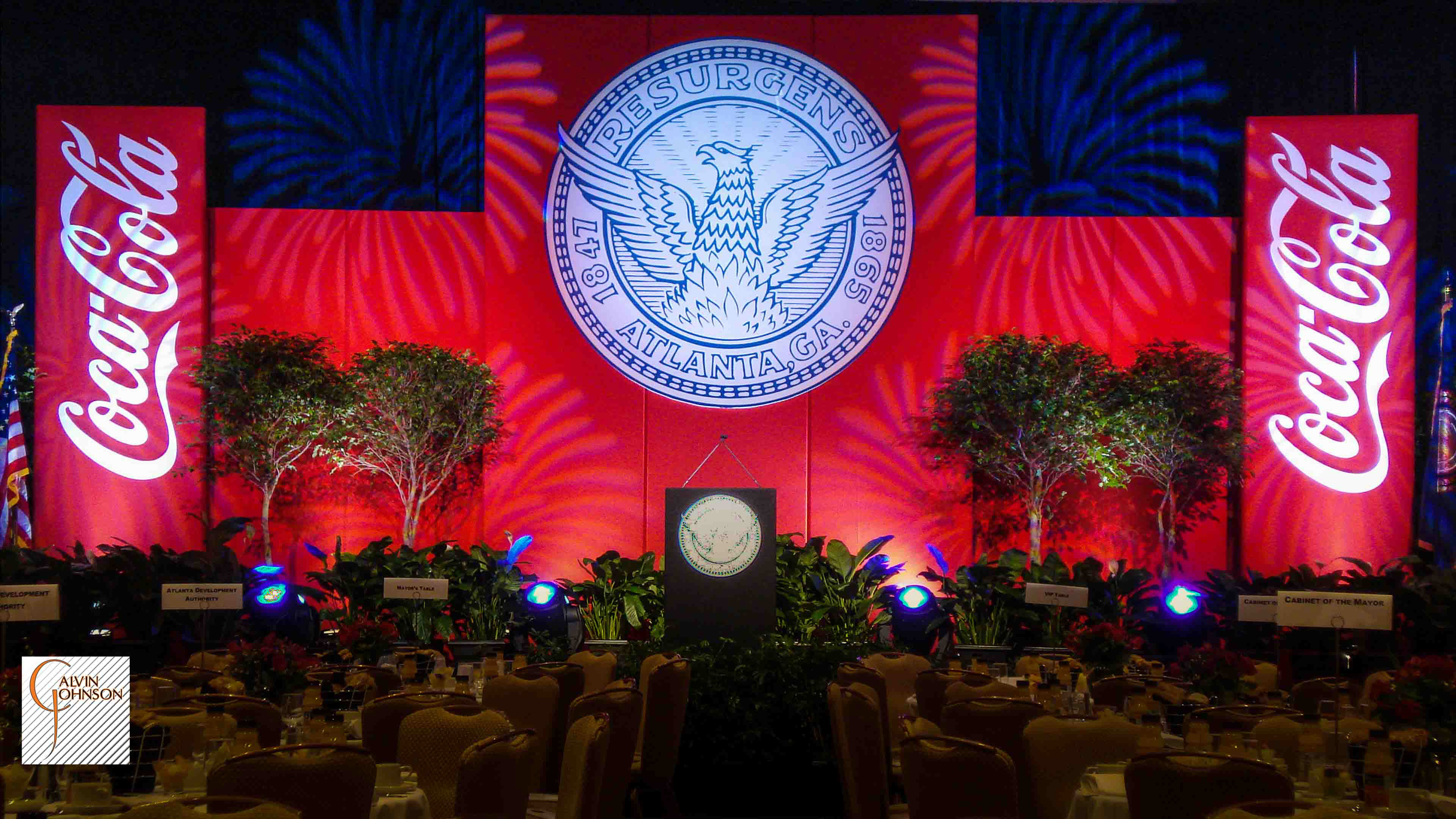 Red Coca-Cola Stage Set with Fireworks light patterns overlayed.