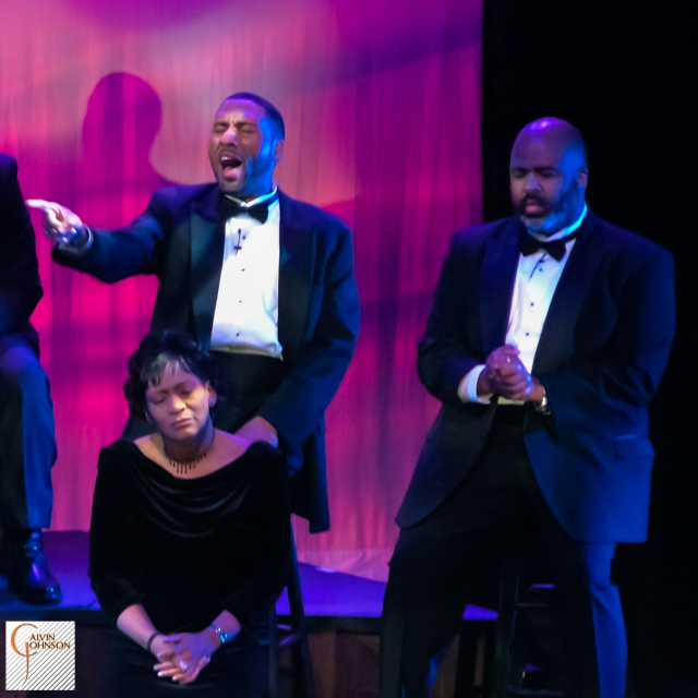 Choral members singing a musical number on stage from The Black Nativity Play.