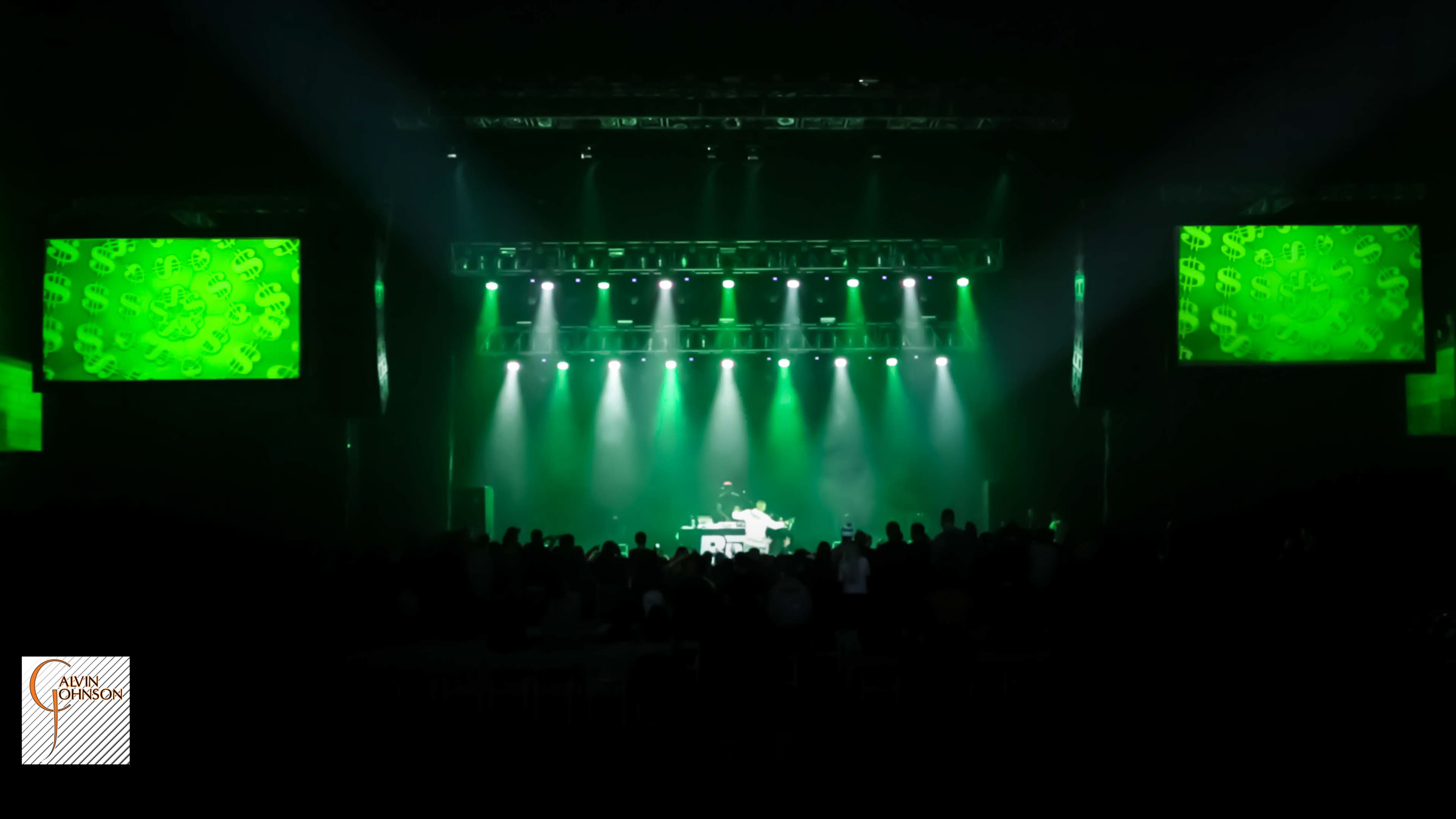 Hip Hop artist B.o.B performing at a concert with DJ Shawty Slim.