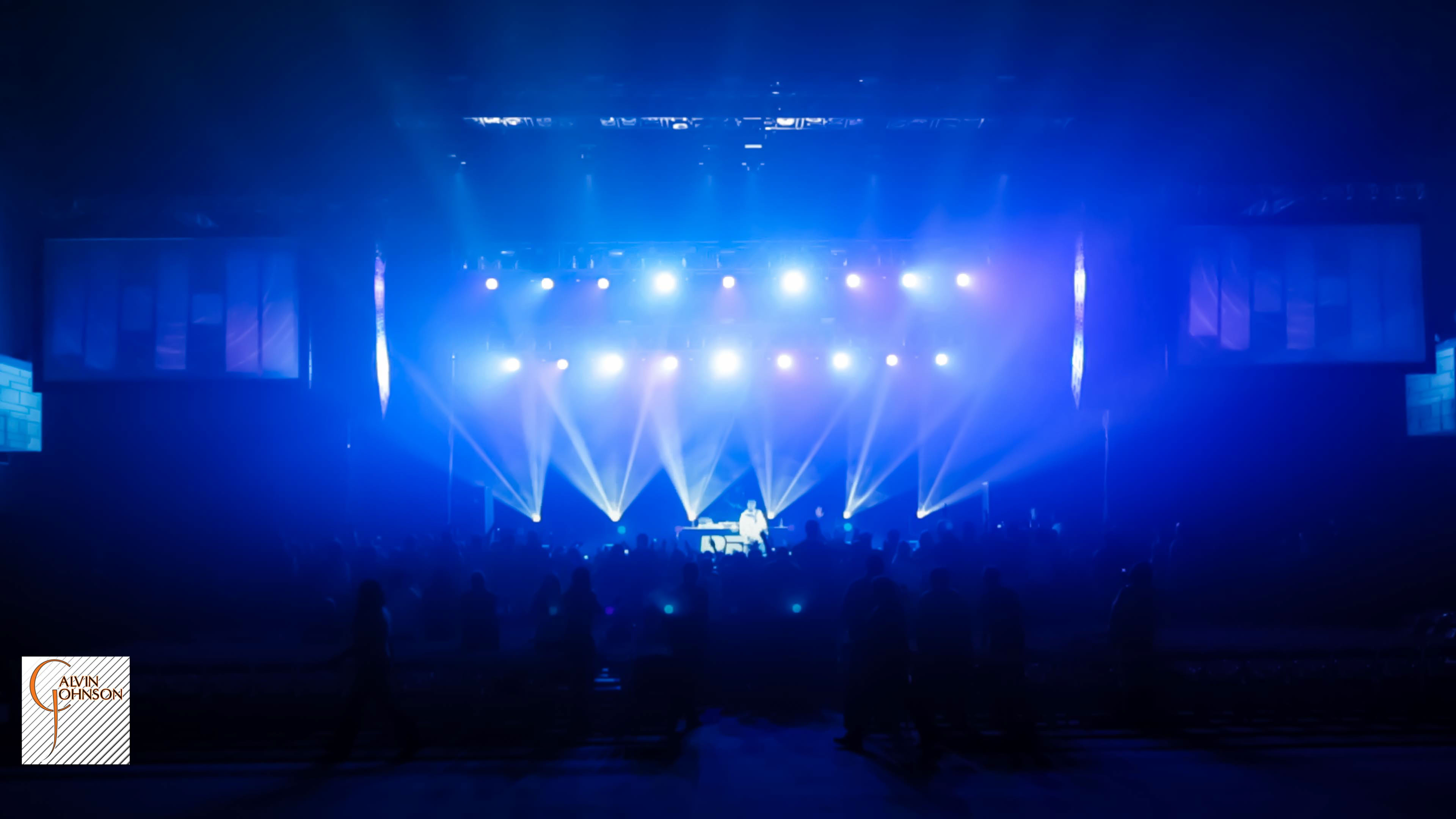 Hip Hop artist B.o.B performing at a concert with DJ Shawty Slim.