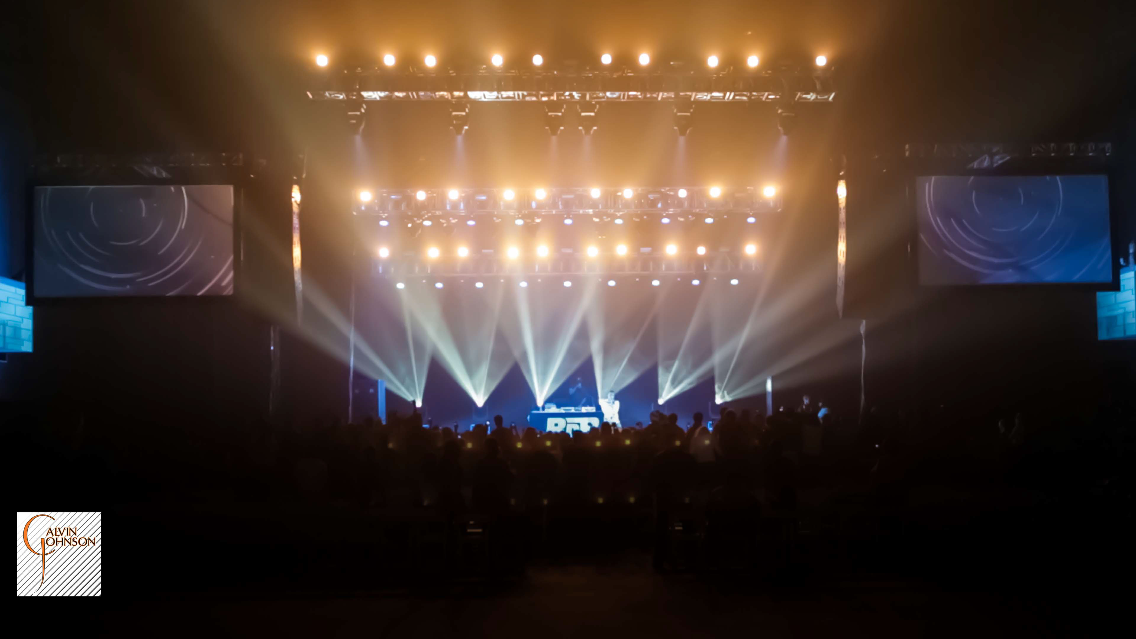 Hip Hop artist B.o.B performing at a concert with DJ Shawty Slim.