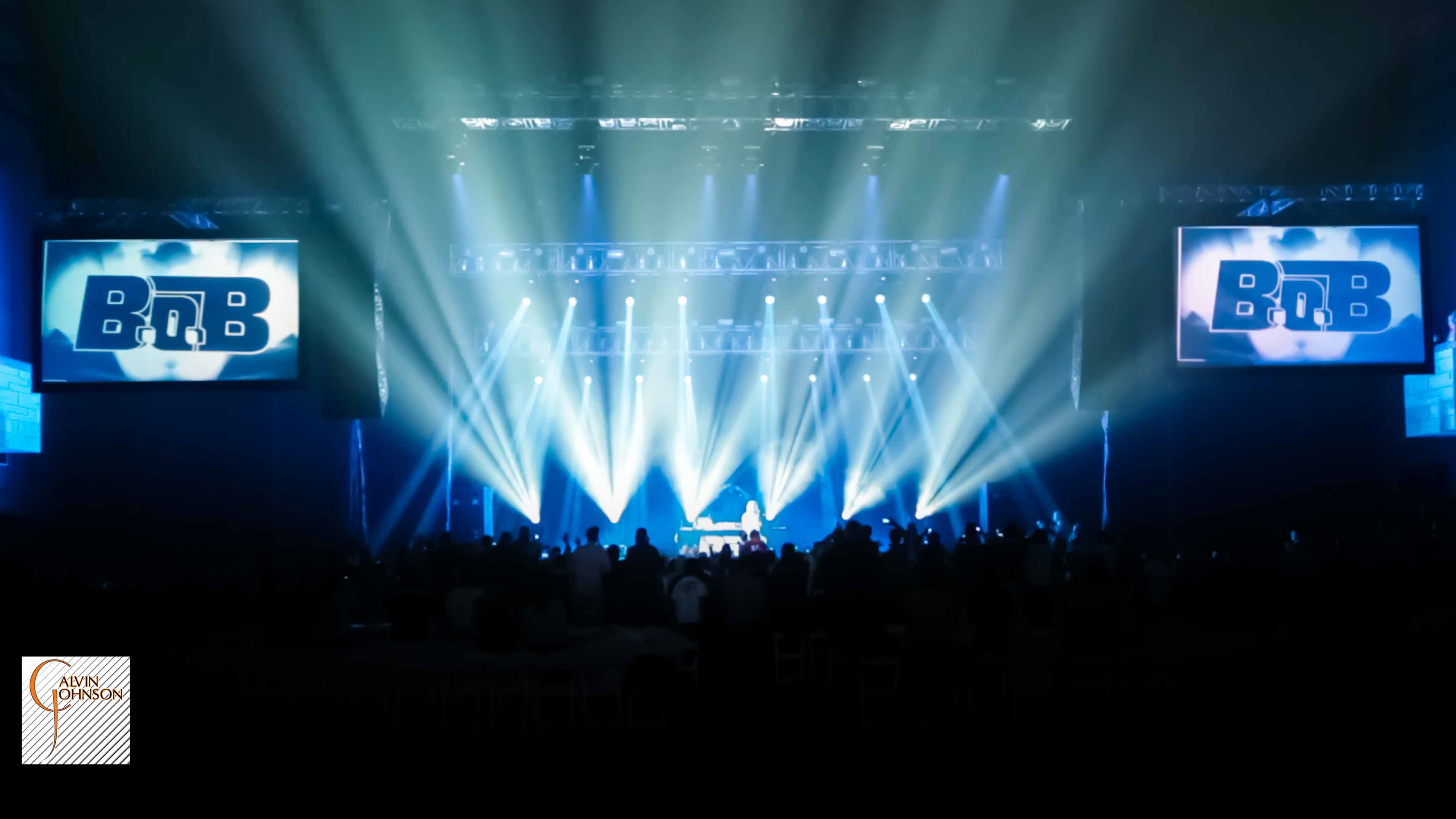 Hip Hop artist B.o.B performing at a concert with DJ Shawty Slim.