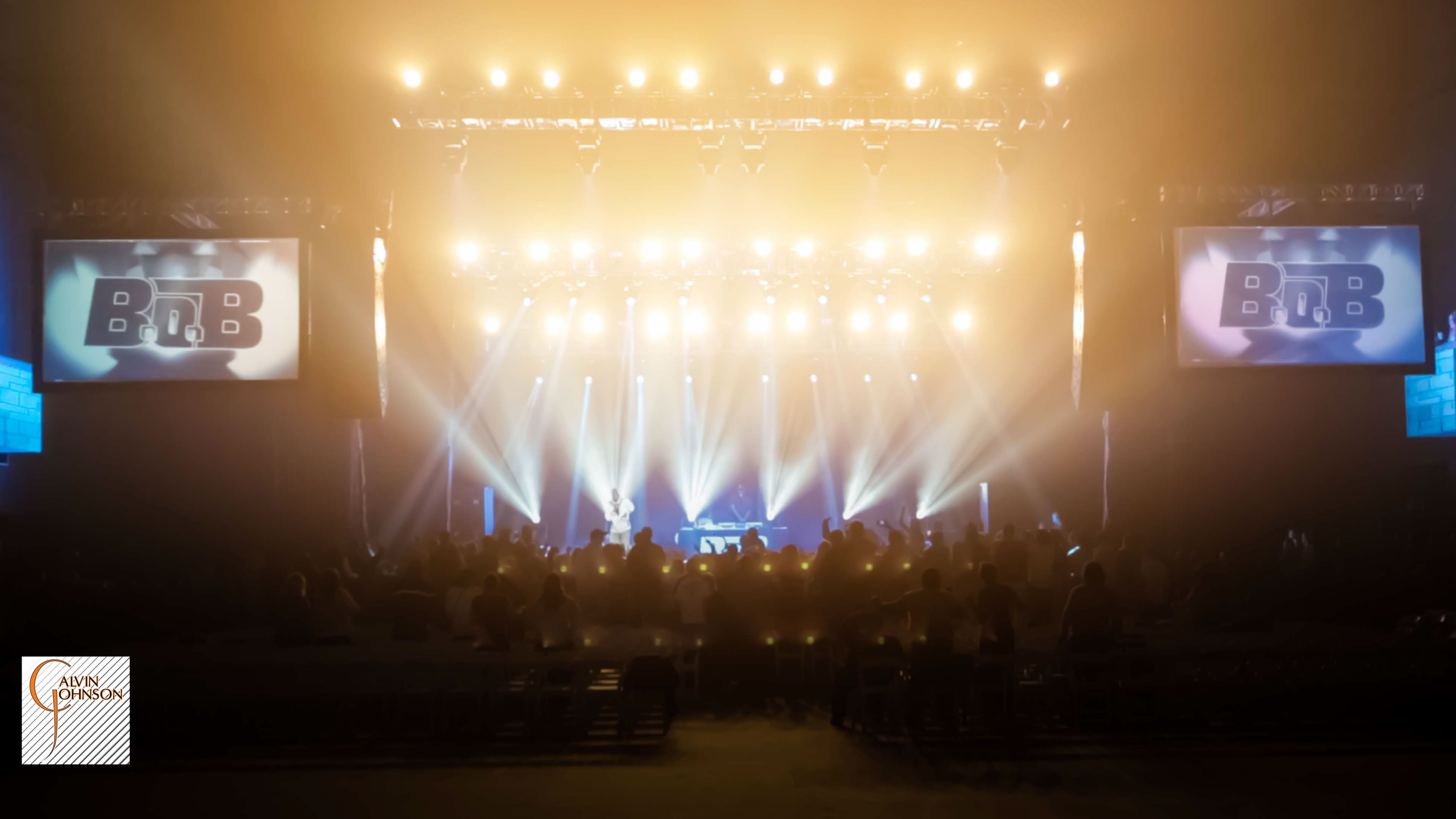 Hip Hop artist B.o.B performing at a concert with DJ Shawty Slim.