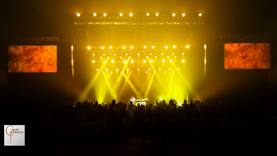 Hip Hop artist B.o.B performing at a concert with DJ Shawty Slim.