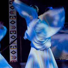 Three ghostly dancers spinning around in the play "Flying Over Purgatory"