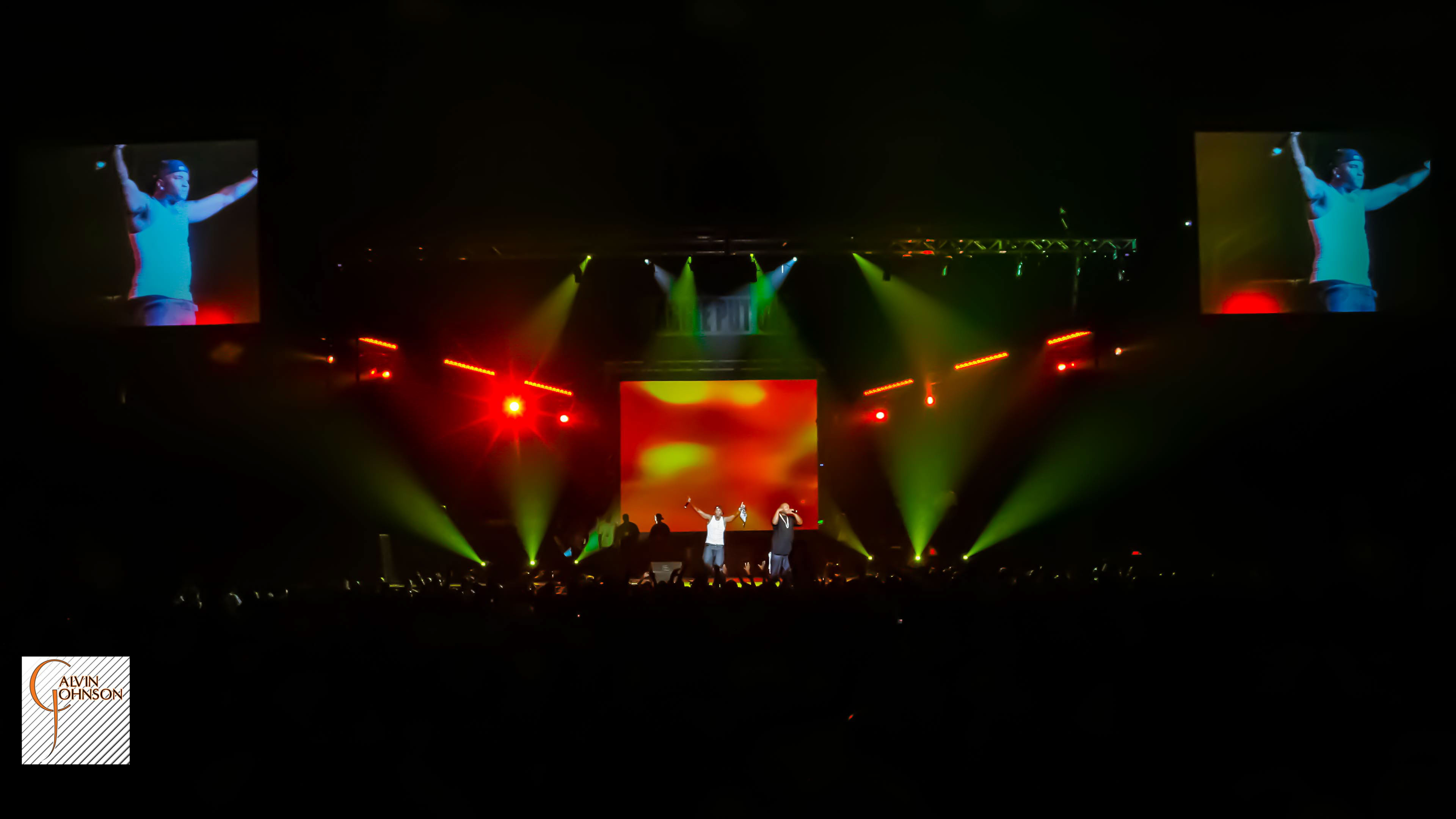 Red lighting and smoke surrounding Young Jeezy at his concert at North Carolina A&T