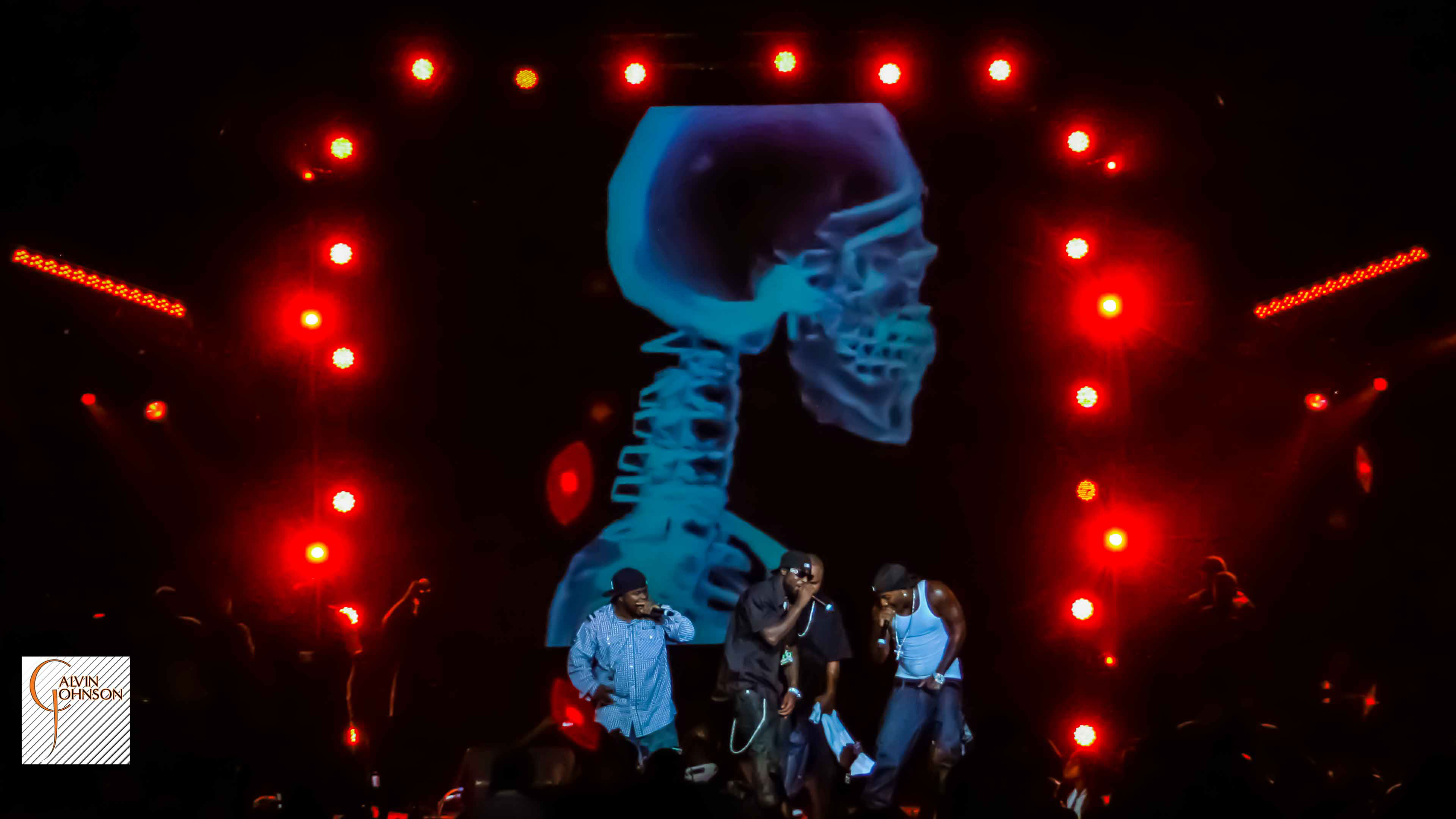 Red lighting and smoke surrounding Young Jeezy at his concert at North Carolina A&T