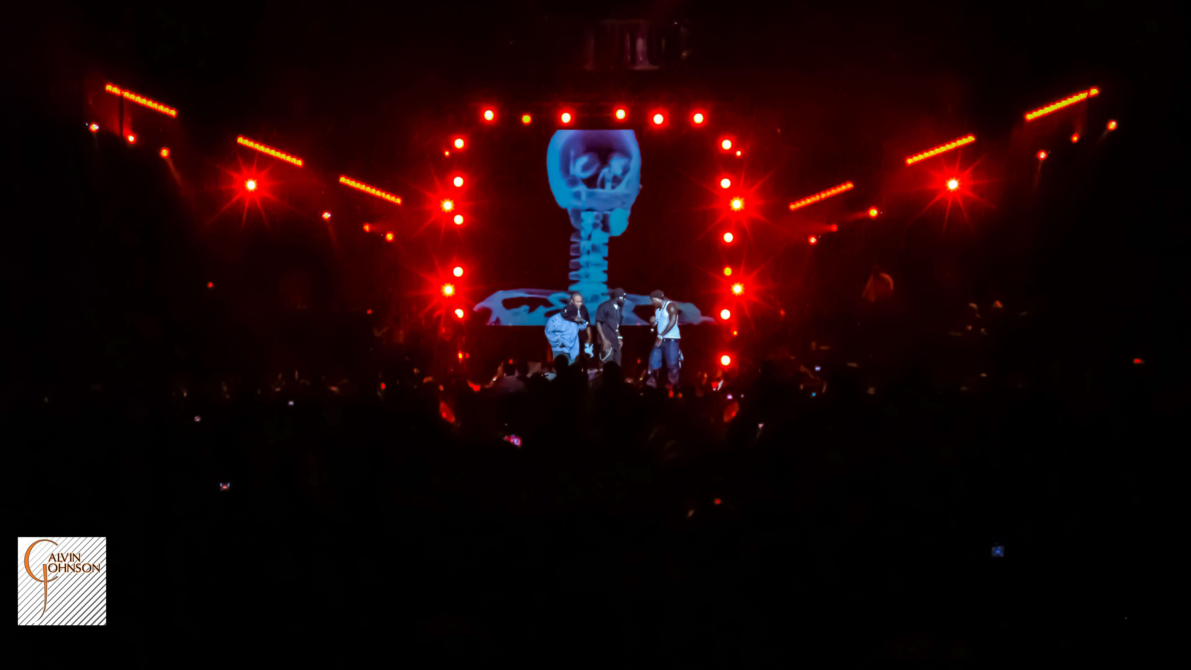 Red lighting and smoke surrounding Young Jeezy at his concert at North Carolina A&T